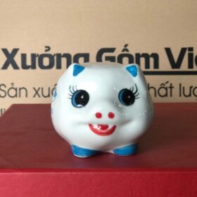 Heo đất mắt tròn mi cong in logo Cô Gạo màu xanh XG-HĐ11